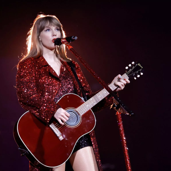 Taylor Swift sings during her Red section of the The Eras Tour. Despite being sold out in every stadium, she was described as having, “the ability to make a huge stadium show feel like an intimate performance,” says Swiftie R. Williams. (Image courtesy of  Wales Online)